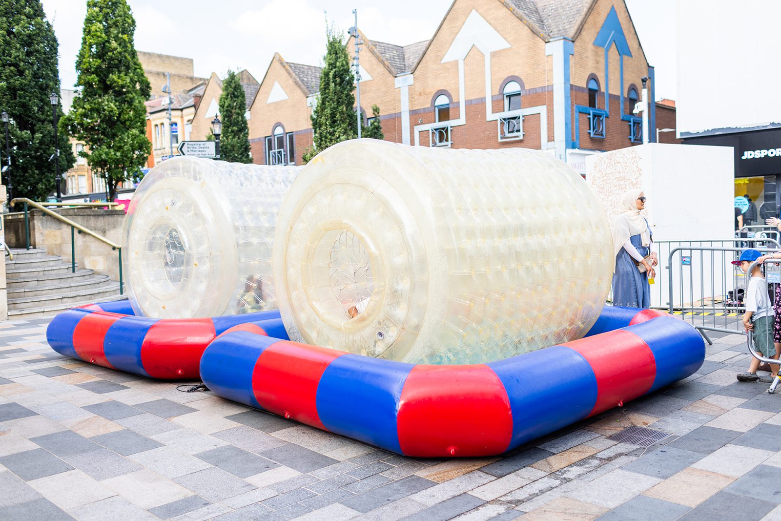 Families queuing for water zorbing across both days