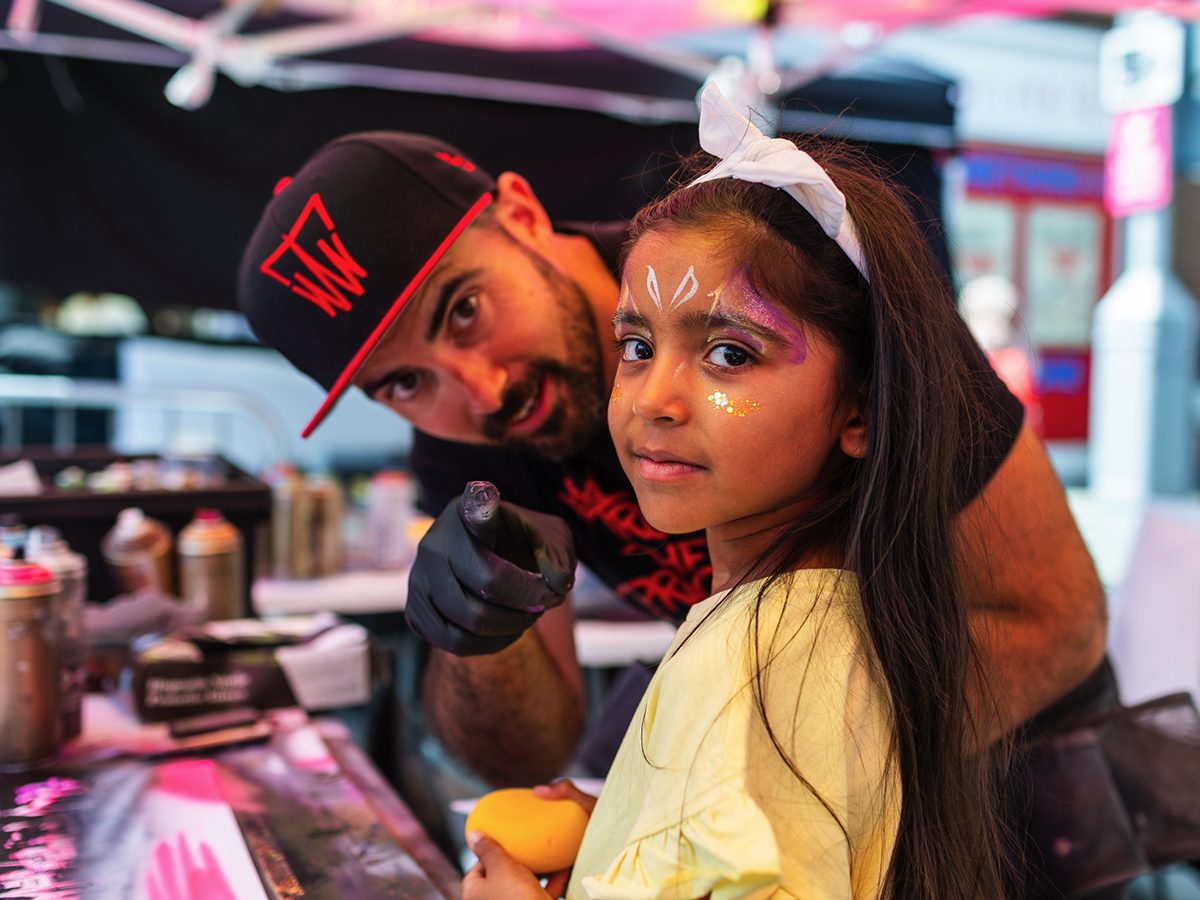 A child taking part in Tom Welly Wells' spray-paint tutorial