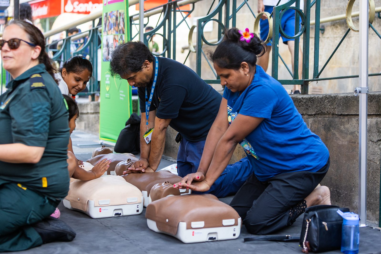 Members of the public learning CPR at Ilford inColour