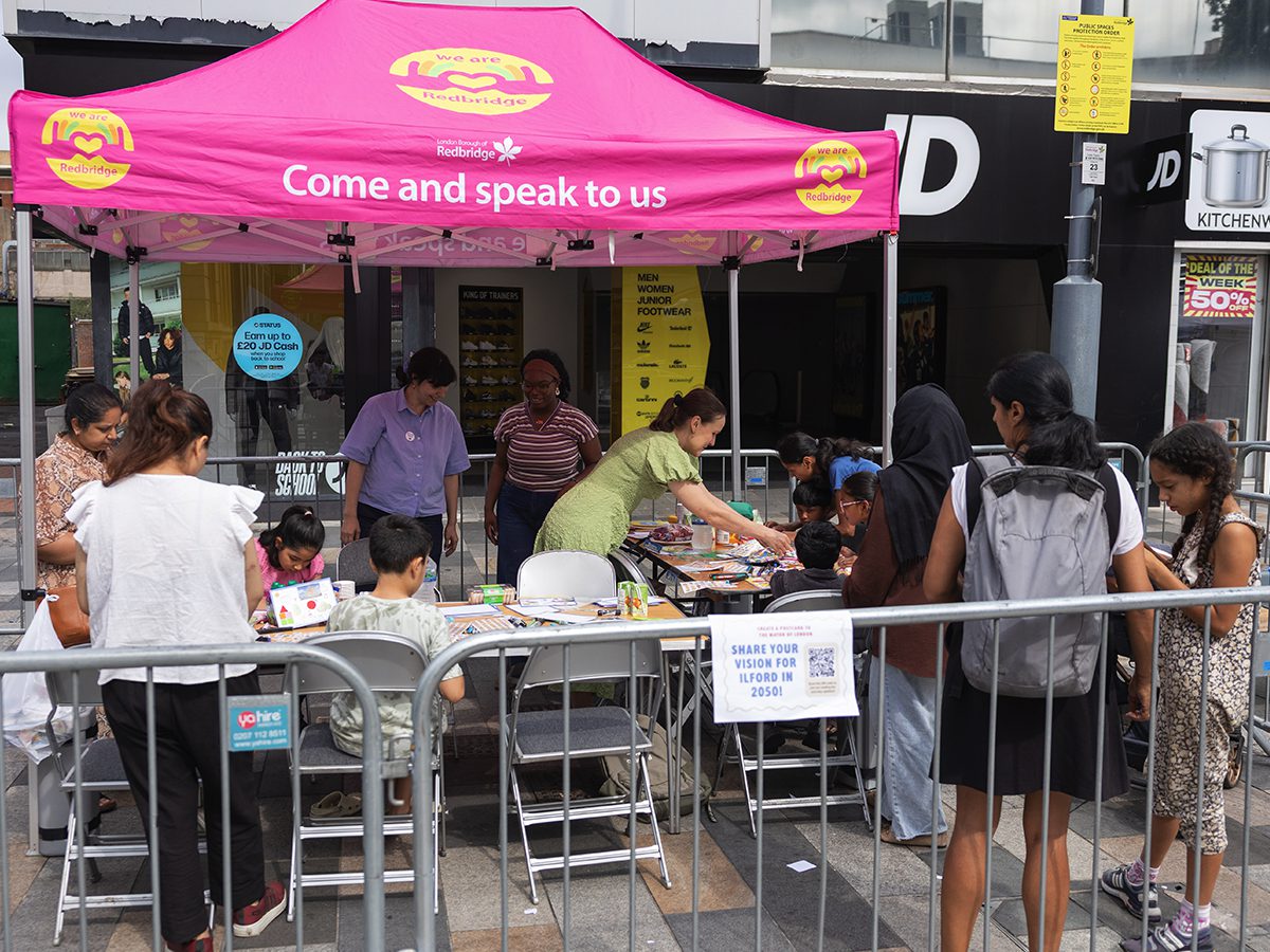 Children and families taking part in the GLA postcard-making activity