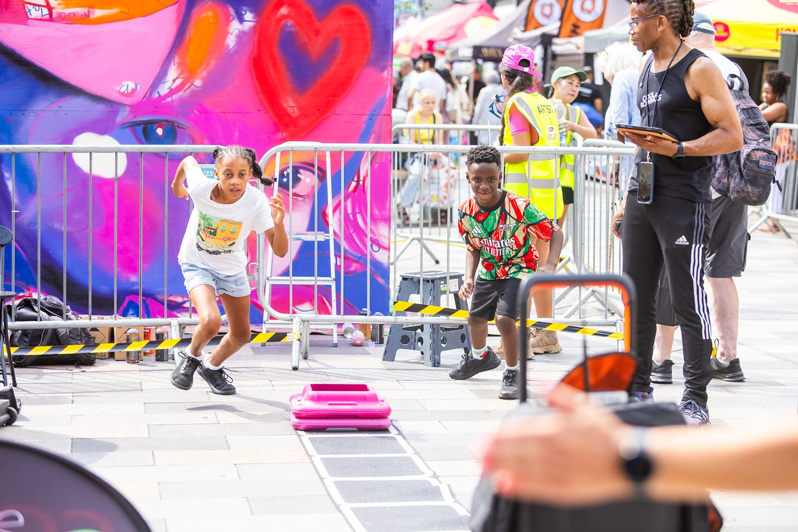 Families taking part in the Gladiator Experience on Ilford High Road