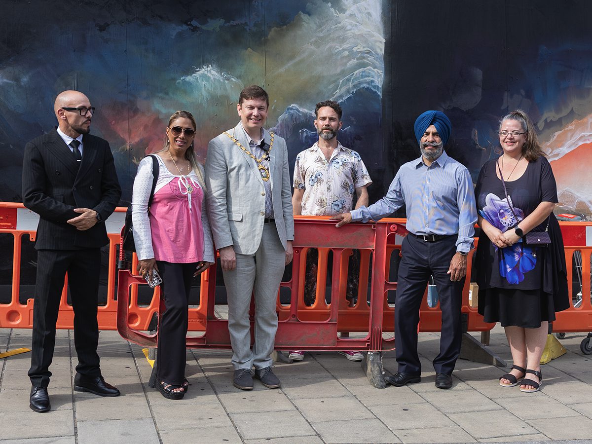 Civic leaders walking between artist locations on the Ilford inColour trail