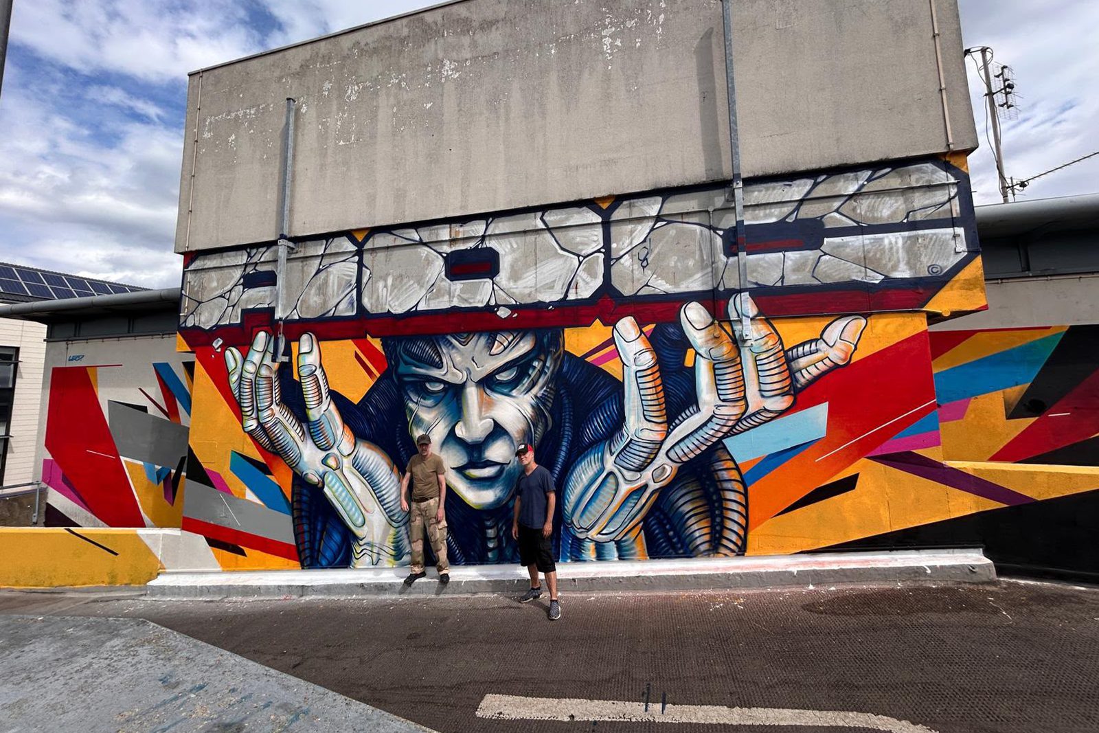 Jason System and Remi Rough with their completed artwork at CitiPark Level 3